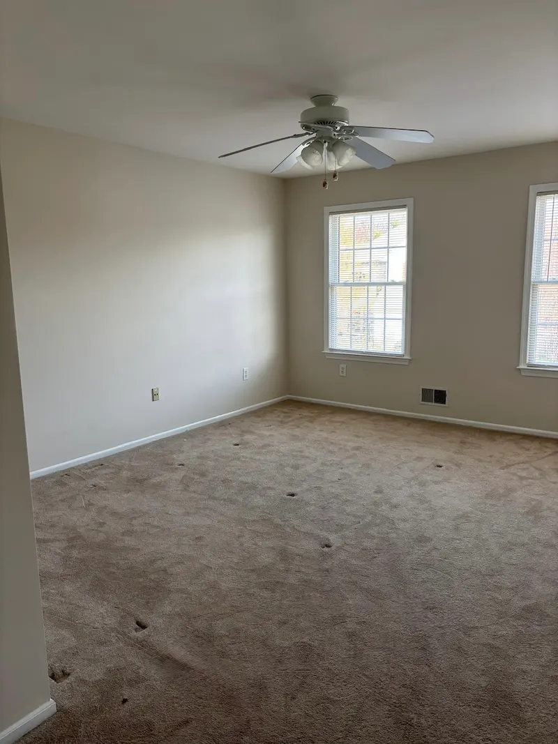 A completely cleared bedroom in a Summit, New Jersey home after JunkDoctors hauled away a bed frame and furniture.