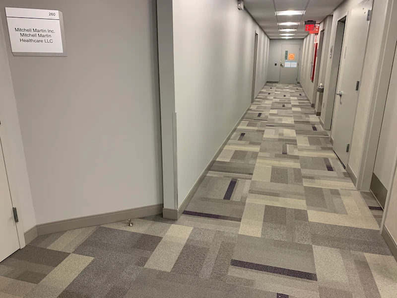 A clean, cleared commercial office hallway in Morristown, North New Jersey after JunkDoctors completed a full commercial cleanout.