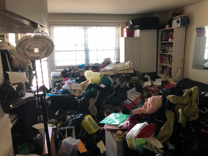 Extreme hoarding situation in a Jersey City, New Jersey apartment featuring high-volume clutter and debris before a professional Junk Doctors cleanout.