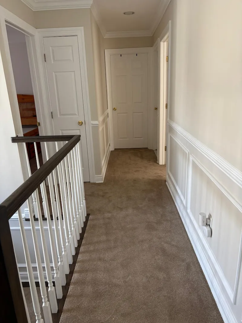 A clean, empty upstairs hallway after Junk Doctors professionally removed mattresses and furniture from a Madison, North Jersey home.