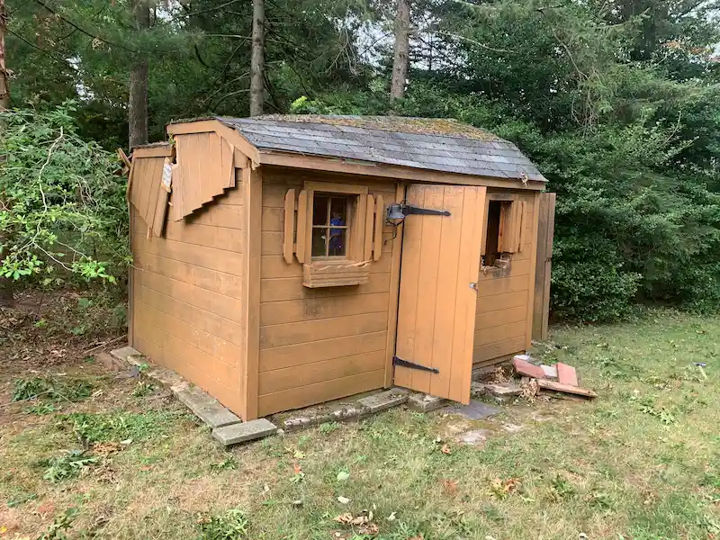 An old wooden backyard shed in North Jersey before being demolished and removed by JunkDoctors.